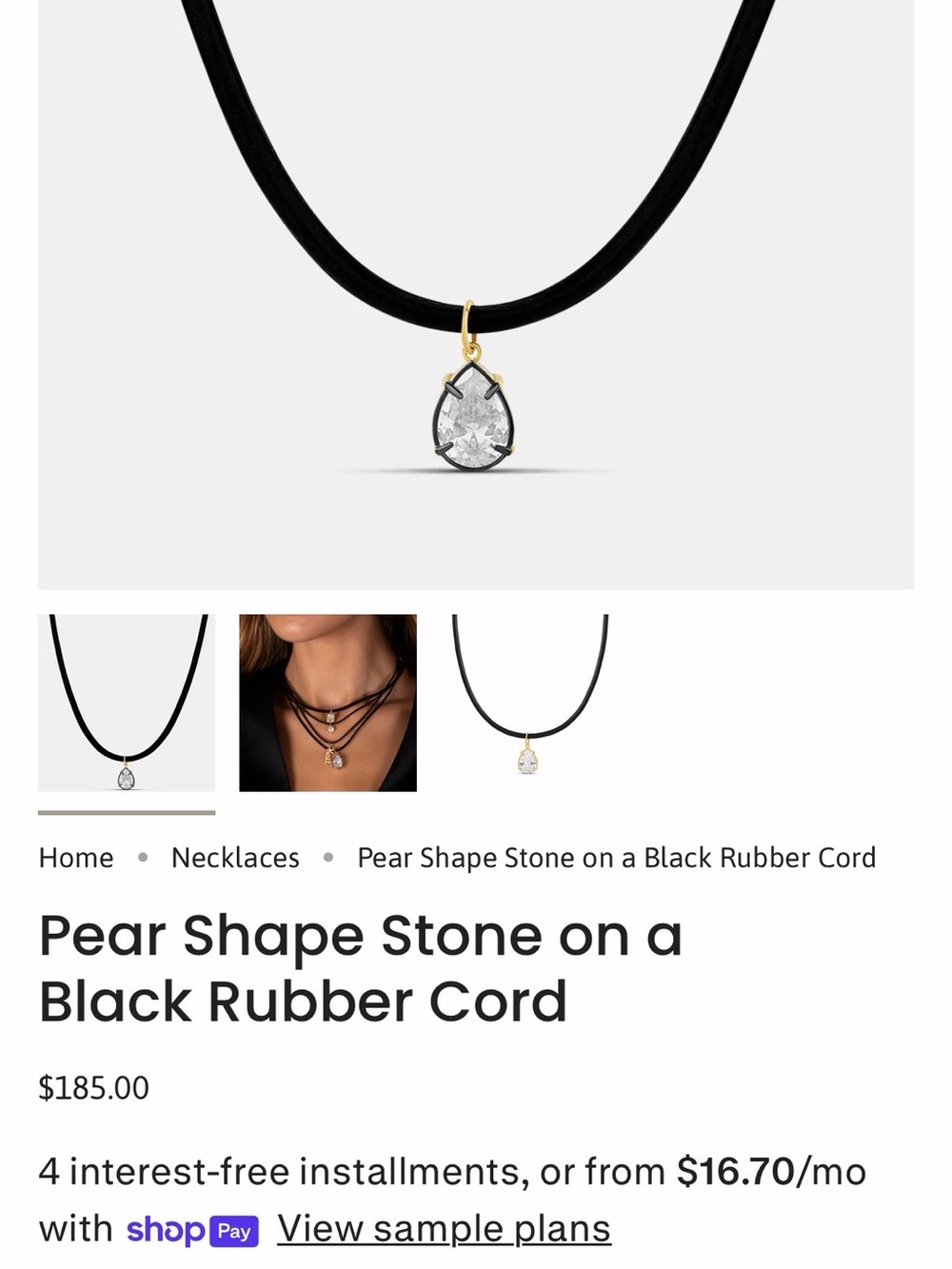 A pear-shaped stone is strung on a black rubber cord. - Picture 4 of 4